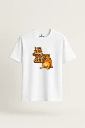 White t-shirt with funny orange tabby cat holding a magnifying glass and sarcastic text: “I Can See Through Your Sh*t” – Swankyss meme-style graphic tee front view