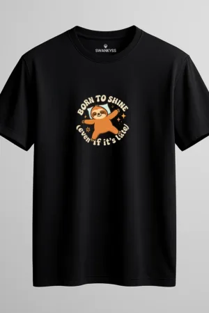 Unisex black cotton T-shirt with "Born to Shine (even if it’s late)" quote and cute sloth graphic printed in the center, casual round neck short sleeve design front view