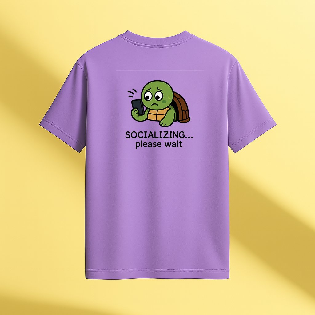 introvert-turtle-socializing-please-wait-optimized lavender unisex t-shirt featuring a cartoon turtle nervously looking at a phone with the phrase “SOCIALIZING... please wait” printed below back view