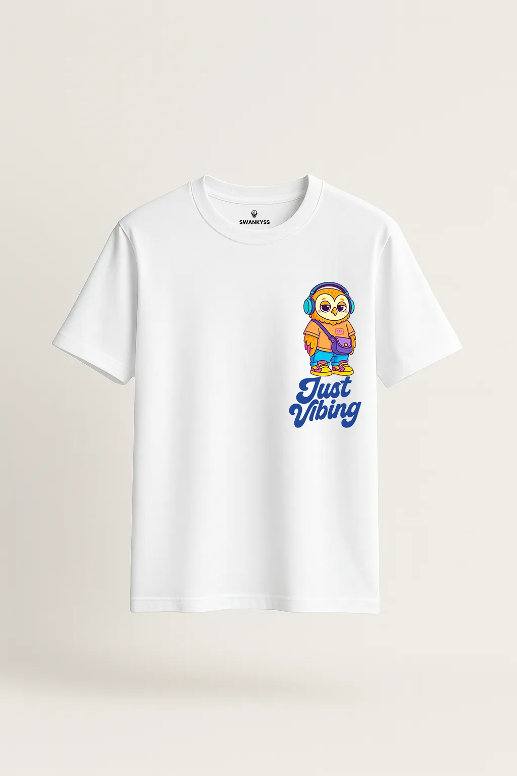 just_vibing_tshirt_under_1000kb White t-shirt with colorful cartoon owl wearing headphones and text “Just Vibing” – fun music lover tee by Swankyss front view