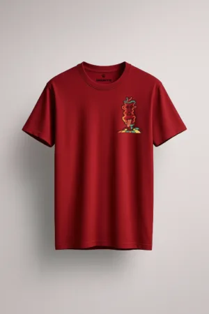 Maroon unisex t-shirt with a small abstract totem-style character graphic printed on the left chest, standing on a colorful checkered base front view