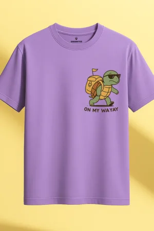Lavender unisex t-shirt with a cool cartoon turtle wearing sunglasses and a backpack, featuring the phrase “On My Wayay” – humorous and slow-paced graphic design by Swankyss front view