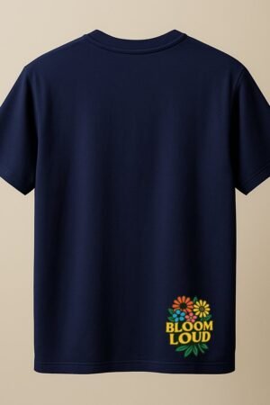 Navy blue unisex t-shirt featuring a colorful cluster of flowers and the phrase “BLOOM LOUD” printed near the bottom hem back view