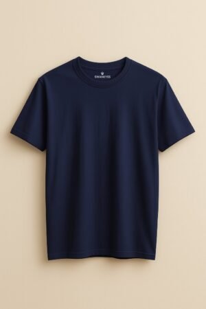 Navy blue t-shirt featuring a relaxed cartoon sloth lying over multicolor rainbow text that says “Relaxer” – cozy unisex design by Swankyss front view