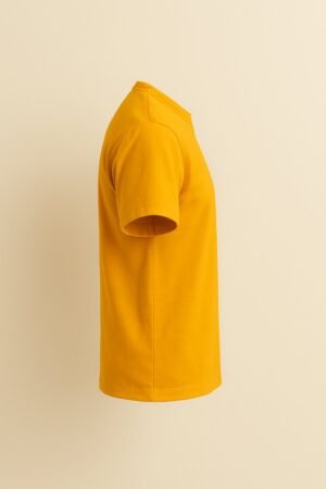 Mustard yellow t-shirt with abstract earth-tone art print featuring geometric shapes and natural elements, unisex fit left side view