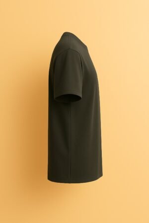 Dark green unisex t-shirt with the phrase “Own Every Awkward Moment” and a cartoon cat wearing sunglasses making rock signs and sticking out its tongue right side view