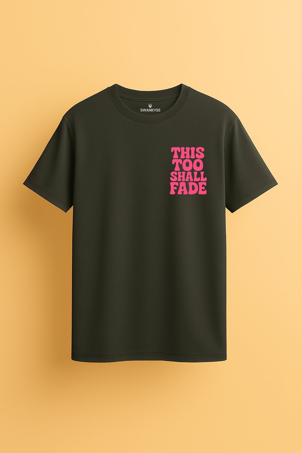 optimized_tshirt_image unisex t-shirt with bold pink retro font that says “This Too Shall Fade” on the chest.