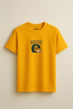 Mustard yellow unisex t-shirt featuring a cartoon hamster slumped beside a wheel with the sarcastic phrase “Same Shit Every Day” above it front view
