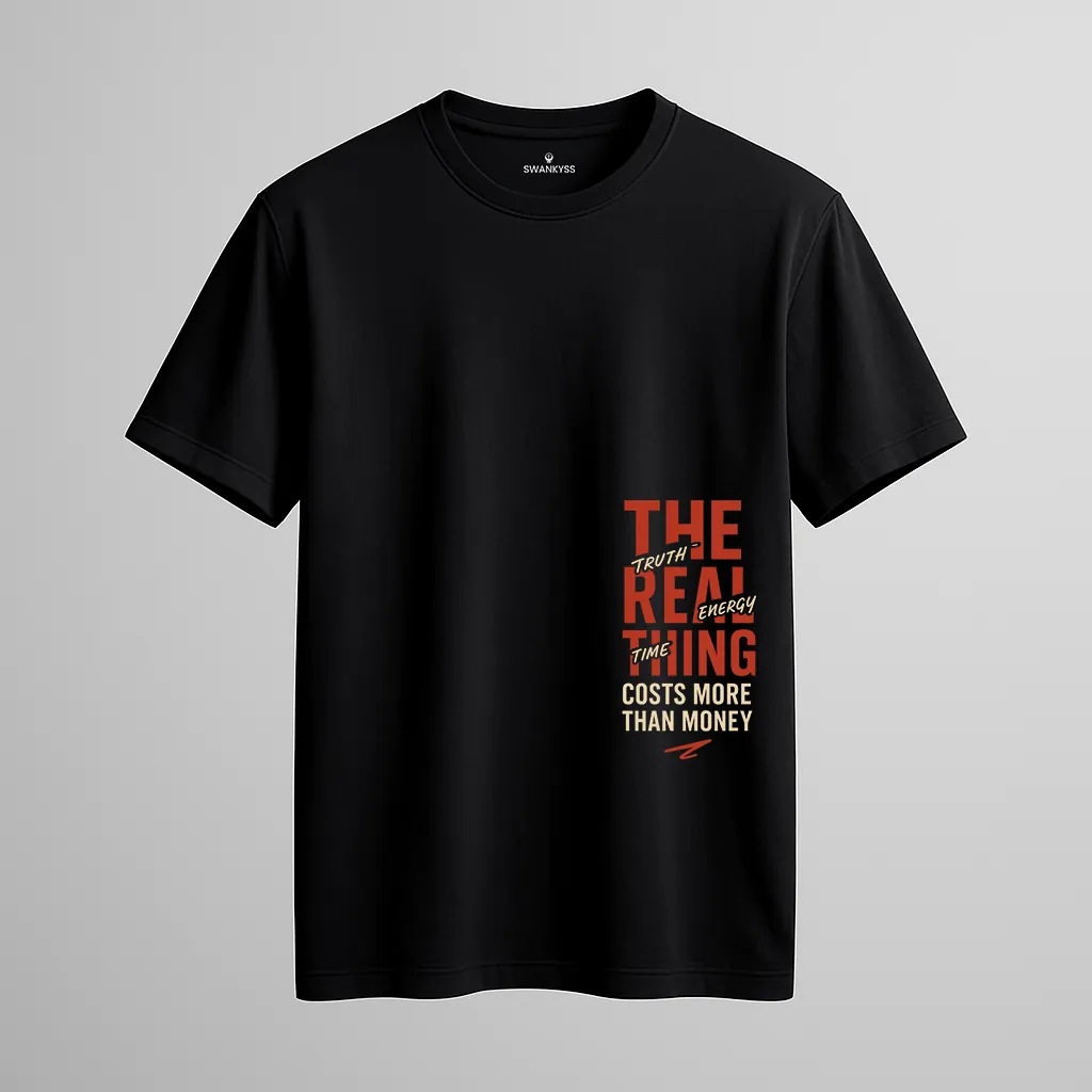 the_real_thing_tshirt_under_1000kb Black unisex t-shirt with motivational typography reading “The Real Thing Costs More Than Money – Truth. Time. Energy.” – bold graphic streetwear by Swankyss front view