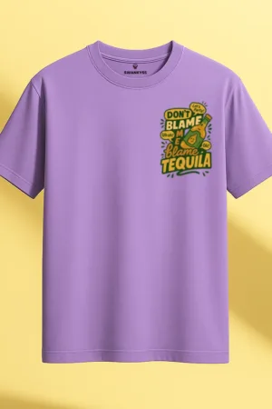 Lavender unisex t-shirt with a playful tequila bottle graphic and the text “Don’t Blame Me, Blame Tequila” in bold yellow and green front view