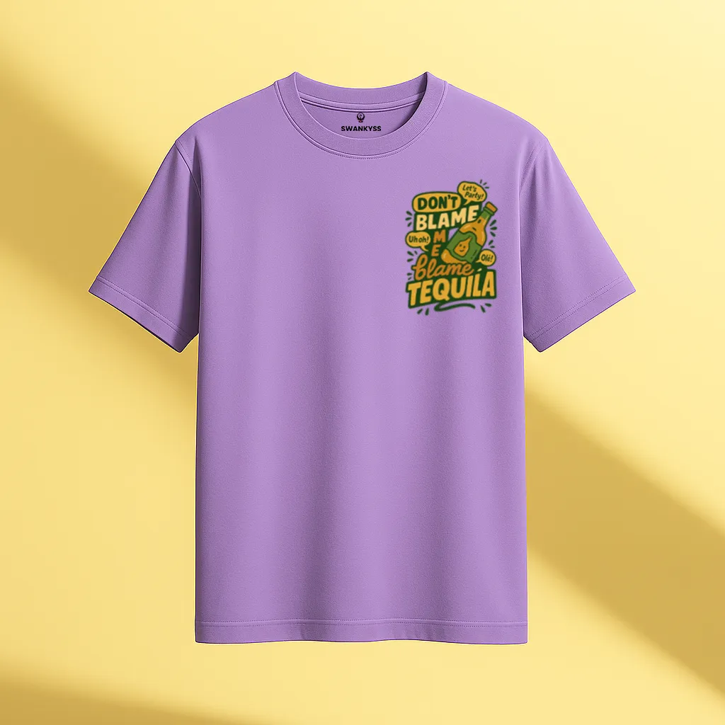 tshirt_blame_tequila_under_1000kb Lavender unisex t-shirt with a playful tequila bottle graphic and the text “Don’t Blame Me, Blame Tequila” in bold yellow and green front view