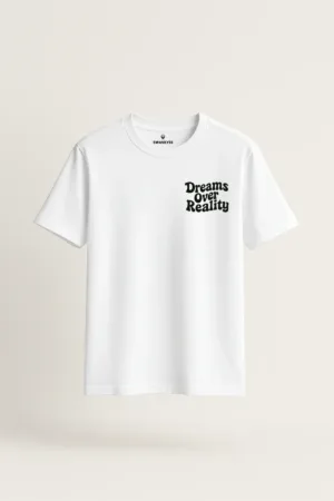 White unisex t-shirt with a minimalist black quote that reads "Dreams Over Reality" on the left chest area front view
