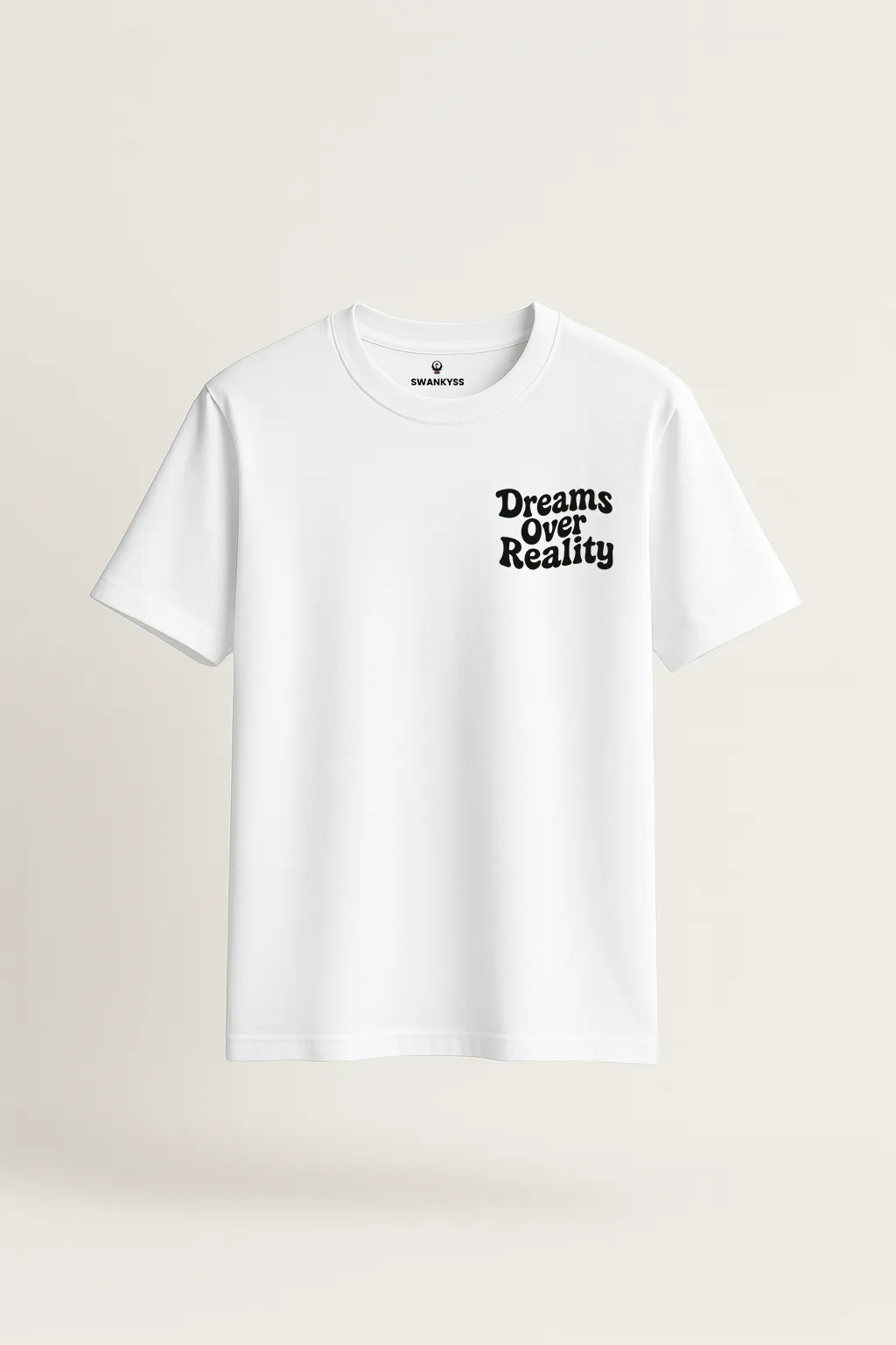 tshirt_dreams_over_reality_under_1000kb White unisex t-shirt with a minimalist black quote that reads "Dreams Over Reality" on the left chest area front view