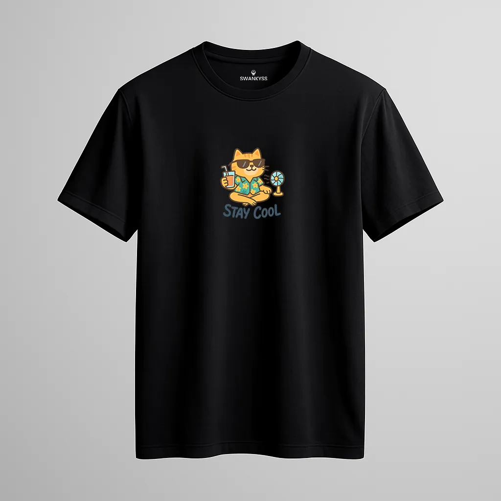 tshirt_stay_cool_under_1000kb Black unisex t-shirt featuring a cartoon cat in sunglasses and Hawaiian shirt holding a drink next to a fan, with “STAY COOL” text underneath front view