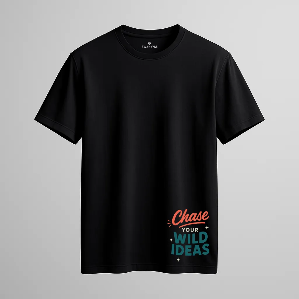 tshirt_wild_ideas_under_1000kb Unisex black cotton T-shirt with motivational lower hem text “Chase Your Wild Ideas” in colorful typography, featuring short sleeves and round neck design front view